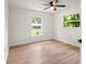 Bright bedroom with ceiling fan and view of the neighborhood at 3236 Kingswood Dr, Sarasota, FL 34232