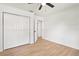 This bedroom features a ceiling fan and a large closet at 3236 Kingswood Dr, Sarasota, FL 34232
