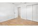 This bedroom features wood-look flooring and a large closet at 3236 Kingswood Dr, Sarasota, FL 34232