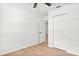 Bedroom featuring a ceiling fan, closet, and access to other rooms at 3236 Kingswood Dr, Sarasota, FL 34232