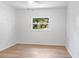 Bright bedroom featuring a ceiling fan and a view of the neighborhood at 3236 Kingswood Dr, Sarasota, FL 34232