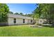 Lovely single-story home featuring a lush green lawn and a well-maintained exterior with mature trees at 3236 Kingswood Dr, Sarasota, FL 34232