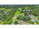 Large lot featuring lush landscaping and a cozy home, offering a serene retreat and ample space for outdoor activities at 3511 39Th E St, Palmetto, FL 34221