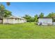 Expansive backyard featuring a well-maintained lawn, storage shed, and ample space, ideal for outdoor activities and relaxation at 3511 39Th E St, Palmetto, FL 34221