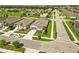 Aerial view of the house within a quiet neighborhood near a soccer field and green spaces at 3602 Quiet Dr, Sarasota, FL 34240