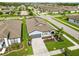 Overhead view of gray home with manicured yard and vibrant landscaping in an active community at 3602 Quiet Dr, Sarasota, FL 34240