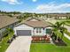 Birds eye view of house with manicured landscaping and driveway in Gathering-friendly neighborhood at 3602 Quiet Dr, Sarasota, FL 34240
