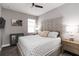 A bedroom features a bed with a tufted headboard, bedside tables, and neutral tones at 3602 Quiet Dr, Sarasota, FL 34240