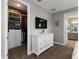 View of closet space from bedroom that also shows a dresser and ensuite entrance at 3602 Quiet Dr, Sarasota, FL 34240
