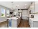 Modern kitchen featuring an island, stainless steel appliances, and ample natural light at 3602 Quiet Dr, Sarasota, FL 34240