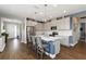 Bright kitchen with large island, stainless appliances, and a herringbone tile backsplash at 3602 Quiet Dr, Sarasota, FL 34240