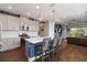 Stylish kitchen with granite countertops, stainless appliances, and a breakfast bar overlooking the living area at 3602 Quiet Dr, Sarasota, FL 34240