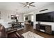 Open-concept living room featuring a dining table, a leather sofa, and modern decor at 3602 Quiet Dr, Sarasota, FL 34240