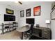 A home office is furnished with modern desk and sports memorabilia at 3602 Quiet Dr, Sarasota, FL 34240