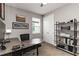 Functional home office with gray desk and shelving at 3602 Quiet Dr, Sarasota, FL 34240