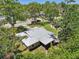 Bird's eye view of the home featuring a new metal roof and screened in porch at 4023 Hina Dr, Sarasota, FL 34241