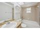 Bright bathroom featuring a tub and shower combination and tile flooring at 4023 Hina Dr, Sarasota, FL 34241