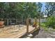 Cozy deck featuring a table and chairs, surrounded by lush green foliage at 4023 Hina Dr, Sarasota, FL 34241
