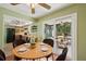 Bright dining area adjacent to the kitchen, with sliding doors leading to outdoor deck at 4023 Hina Dr, Sarasota, FL 34241