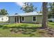 A lovely single-story home with new metal roof and cozy screened in porch at 4023 Hina Dr, Sarasota, FL 34241
