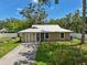 Charming home with a well-manicured front yard and a metal roof at 4023 Hina Dr, Sarasota, FL 34241