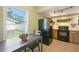 Bright kitchenette features a view of the yard and includes a compact dining area at 4023 Hina Dr, Sarasota, FL 34241