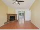 Spacious living room with a stone fireplace and open layout to a screened porch at 4023 Hina Dr, Sarasota, FL 34241