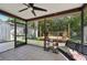 Covered, screened porch featuring tile floor, plus views of the shed and back yard at 4023 Hina Dr, Sarasota, FL 34241