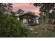 The home has a cozy screened in porch perfect for enjoying the outdoors at 4023 Hina Dr, Sarasota, FL 34241