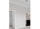 A bedroom with multiple doors and a view to the ensuite bathroom and walk-in closet at 407 157Th E Ct, Bradenton, FL 34212