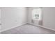 Bedroom with a window with patterned curtains at 407 157Th E Ct, Bradenton, FL 34212