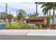 Coddington neighborhood sign with palm trees, plants and flowers at 407 157Th E Ct, Bradenton, FL 34212