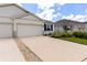 Charming single-story home featuring a two-car garage and well-maintained landscaping at 407 157Th E Ct, Bradenton, FL 34212