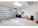 Spacious garage with overhead lighting and plenty of room for storage and vehicles at 407 157Th E Ct, Bradenton, FL 34212