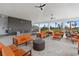 Stylish outdoor lounge area with comfortable seating, bar, and scenic views for relaxing and socializing at 407 157Th E Ct, Bradenton, FL 34212