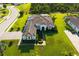 Aerial view of a single Gathering home showcasing landscaping, a brick driveway, and tile roof at 408 166Th E St, Bradenton, FL 34212