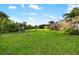 Expansive backyard with a playset and ample green space at 408 166Th E St, Bradenton, FL 34212