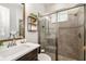 Modern bathroom with a glass-enclosed shower and decorative shelving at 408 166Th E St, Bradenton, FL 34212