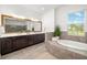 Spacious bathroom featuring a soaking tub and double vanity sinks at 408 166Th E St, Bradenton, FL 34212