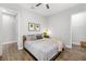Minimalist bedroom featuring wood-look floors, neutral colors, and closet access at 408 166Th E St, Bradenton, FL 34212
