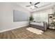 Cozy bedroom with a daybed, large screen, and a ceiling fan at 408 166Th E St, Bradenton, FL 34212