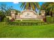 Stone entrance sign for Rye Wilderness, surrounded by lush landscaping and green grass at 408 166Th E St, Bradenton, FL 34212