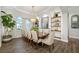 Bright dining room with modern lighting and elegant decor for Gathering gatherings at 408 166Th E St, Bradenton, FL 34212