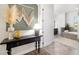 Stylish entryway with a decorative table and a view of the bathroom at 408 166Th E St, Bradenton, FL 34212