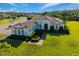 Beautiful single-story home featuring lush landscaping, a tile roof, and a well-manicured lawn at 408 166Th E St, Bradenton, FL 34212