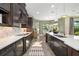 Spacious gourmet kitchen features ample counter space, stainless steel appliances, and designer finishes at 408 166Th E St, Bradenton, FL 34212