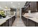 Open-concept kitchen with stainless steel appliances, an island, and seamless access to the living areas at 408 166Th E St, Bradenton, FL 34212
