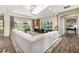 Bright living room with a large sectional sofa and sliding glass doors to the pool at 408 166Th E St, Bradenton, FL 34212