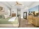 Bright main bedroom with modern decor and a hallway leading to the bathroom at 408 166Th E St, Bradenton, FL 34212