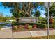 Landscaped entrance sign welcomes residents and visitors to the Wilderness Park neighborhood at 408 166Th E St, Bradenton, FL 34212